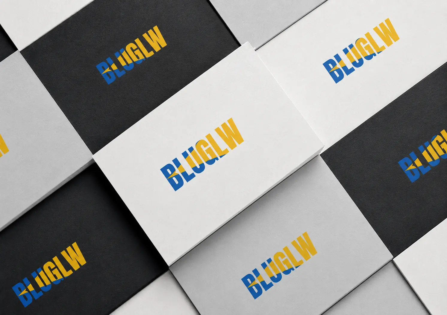 BLUGLW printed brand identity business cards arrangement
