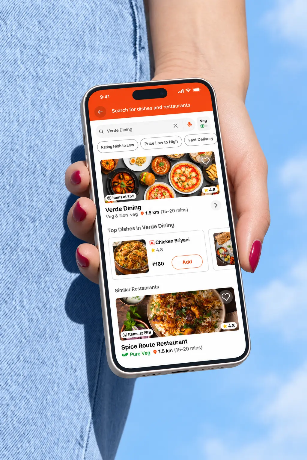 Hand holding smartphone in outdoor daylight displaying restaurant menu listings